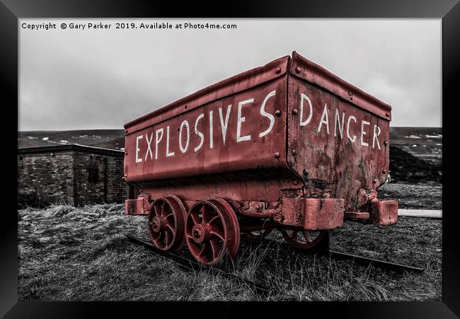 A bright red, weathered, mine cart Framed Print by Gary Parker