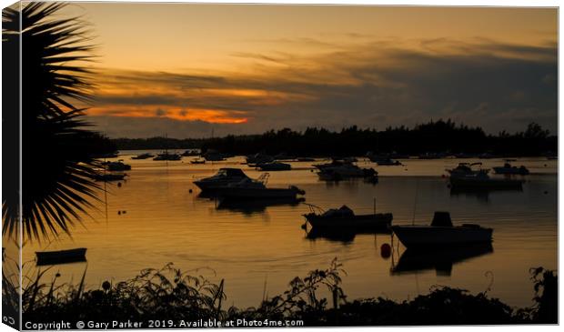 Silhouetted Boats in a Natural Harbour at Sunset Canvas Print by Gary Parker