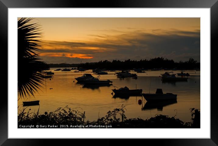 Silhouetted Boats in a Natural Harbour at Sunset Framed Mounted Print by Gary Parker