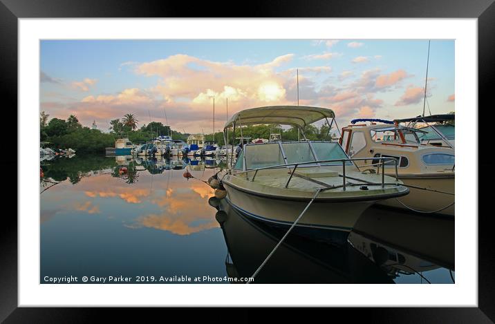 Boats moored in a natural harbour Framed Mounted Print by Gary Parker