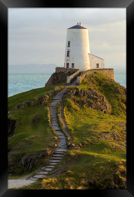 The beautiful Twr Mawr Lighthouse on Llanddwyn Isl Framed Print by CHRIS BARNARD