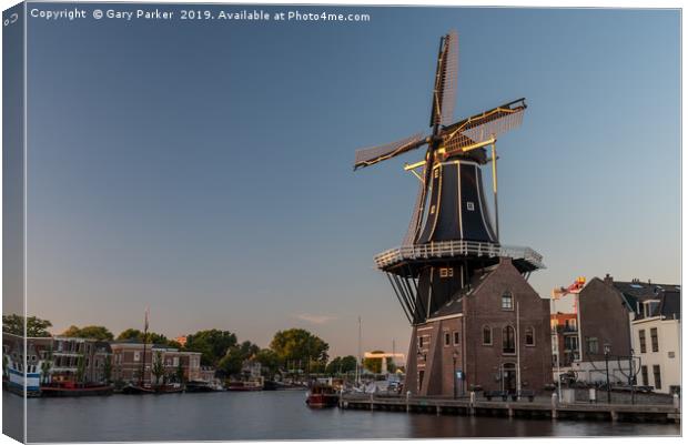 Dutch windmill, in the town of Haarlem, at sunset. Canvas Print by Gary Parker