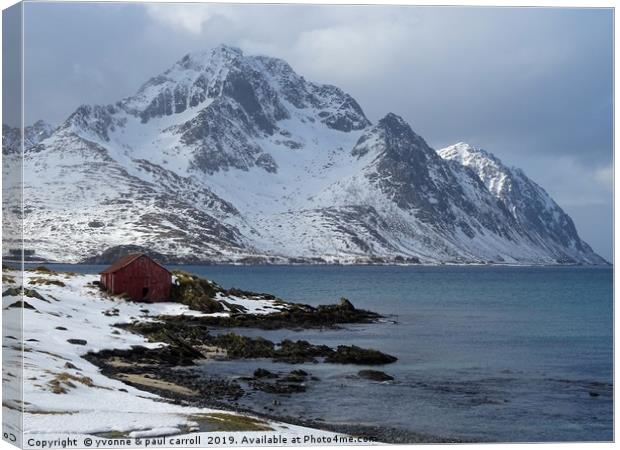 Fisherman's cabin in the snow on the fjord Lofoten Canvas Print by yvonne & paul carroll