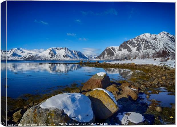 Snowy boulders at the edge of the fjord, Lofoten  Canvas Print by yvonne & paul carroll
