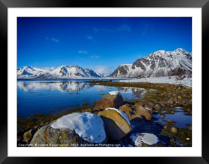 Snowy boulders at the edge of the fjord, Lofoten  Framed Mounted Print by yvonne & paul carroll