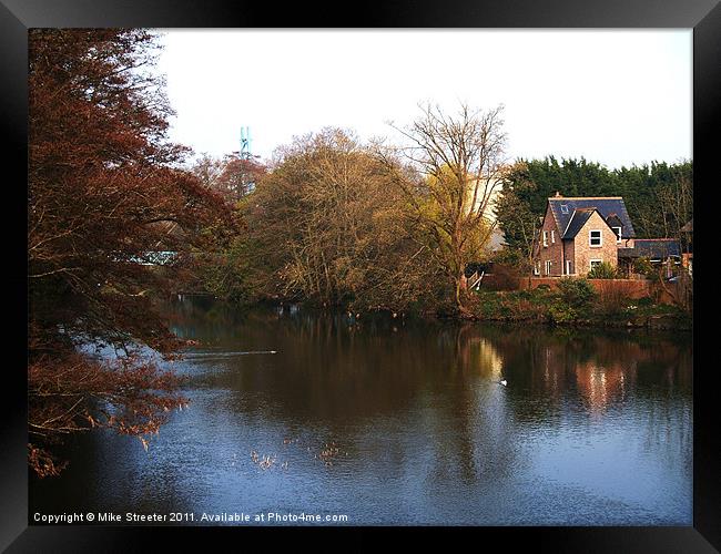 Cottage by the river Framed Print by Mike Streeter