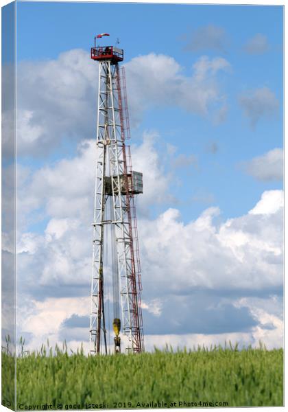 oil drilling rig and blue sky Canvas Print by goce risteski