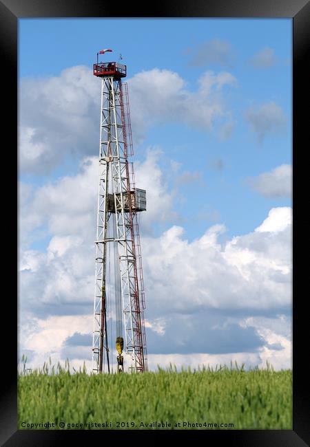 oil drilling rig and blue sky Framed Print by goce risteski