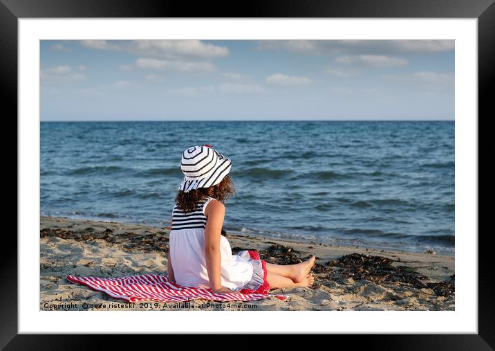 little girl sitting on beach Framed Mounted Print by goce risteski