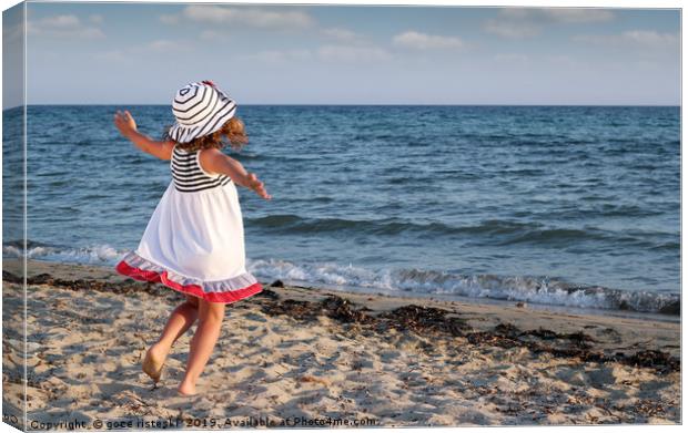 happy little girl running on beach Canvas Print by goce risteski