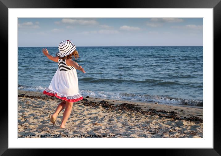 happy little girl running on beach Framed Mounted Print by goce risteski