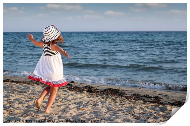 happy little girl running on beach Print by goce risteski