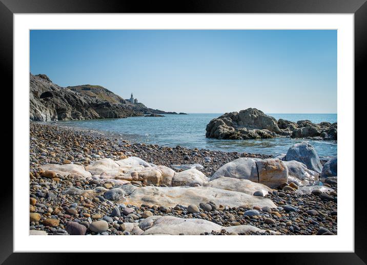 Mumbles lighthouse viewed from Bracelet bay. Framed Mounted Print by Bryn Morgan