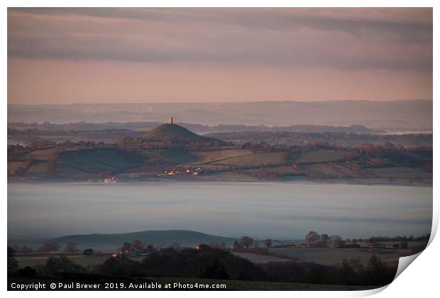 Glastonbury Tor at Sunrise surrounded by mist  Print by Paul Brewer