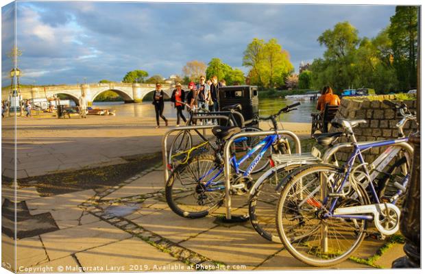 Bikes at the river bank in Richmond Canvas Print by Malgorzata Larys