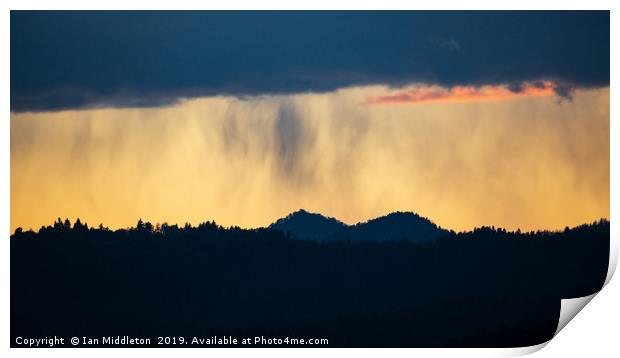 Rain at sunset over the Ljubljana hills Print by Ian Middleton