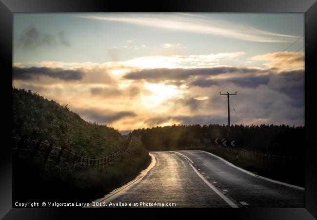 Scottish landscape, the road at the sunset Framed Print by Malgorzata Larys