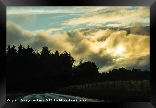 Scottish landscape, the road at the sunset Framed Print by Malgorzata Larys