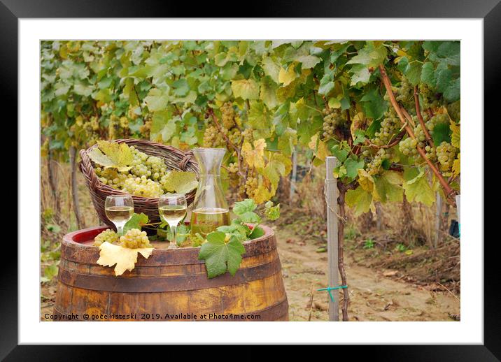 white wine and grape on barrel in vineyard Framed Mounted Print by goce risteski