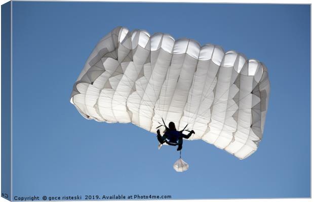 parachutist on blue sky extreme sport  Canvas Print by goce risteski