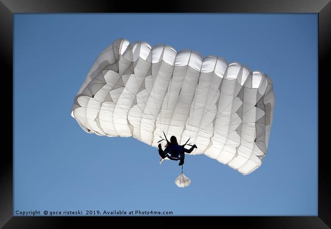 parachutist on blue sky extreme sport  Framed Print by goce risteski