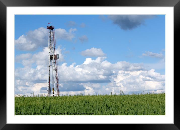 landscape with oil drilling rig blue sky and green Framed Mounted Print by goce risteski