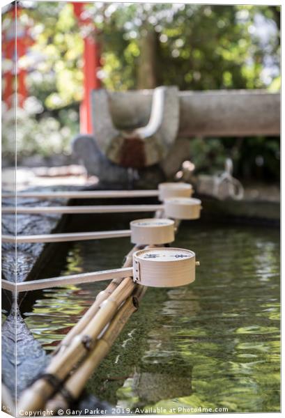 Row of ceremonial water cups at Japanese temple Canvas Print by Gary Parker