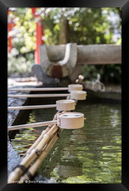 Row of ceremonial water cups at Japanese temple Framed Print by Gary Parker