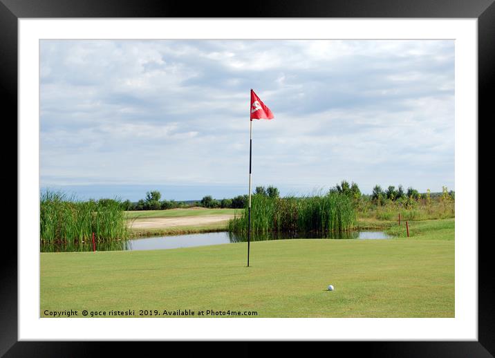golf course with red flag and ball Framed Mounted Print by goce risteski