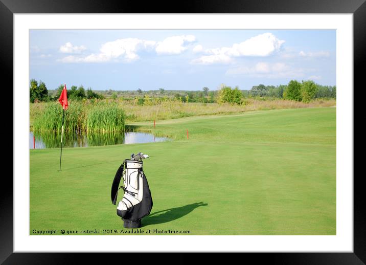 white golf bag on golf course Framed Mounted Print by goce risteski