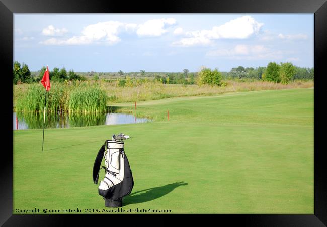 white golf bag on golf course Framed Print by goce risteski