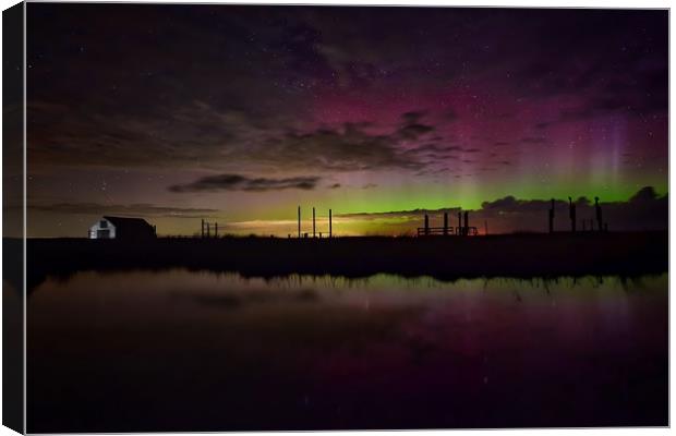Northern lights over the old coal barn at Thornham Canvas Print by Gary Pearson