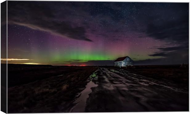 Northern lights over the old coal barn at Thornham Canvas Print by Gary Pearson