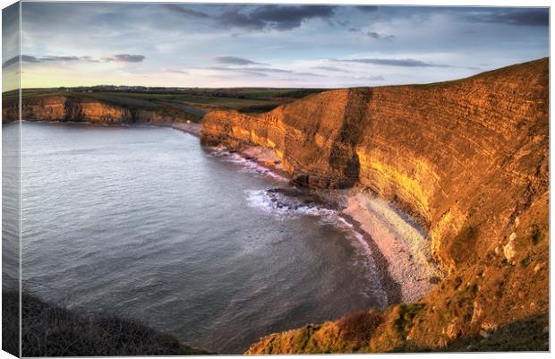 Dusk at Dunraven bay Canvas Print by Leighton Collins