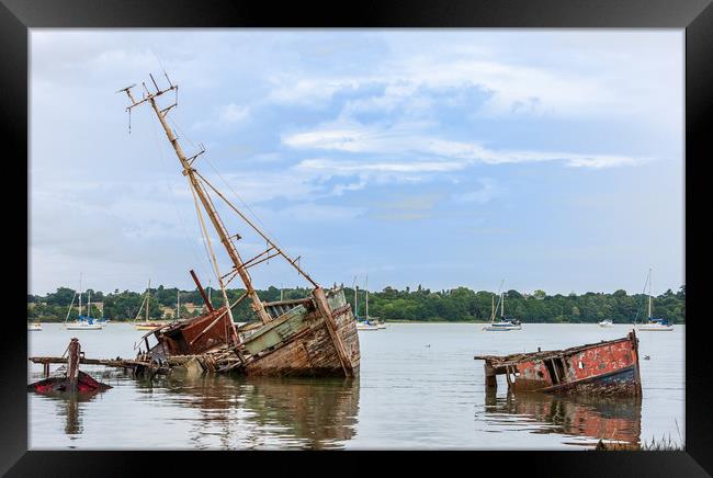 Decaying Fleet Surrenders to Tides Framed Print by Kevin Snelling