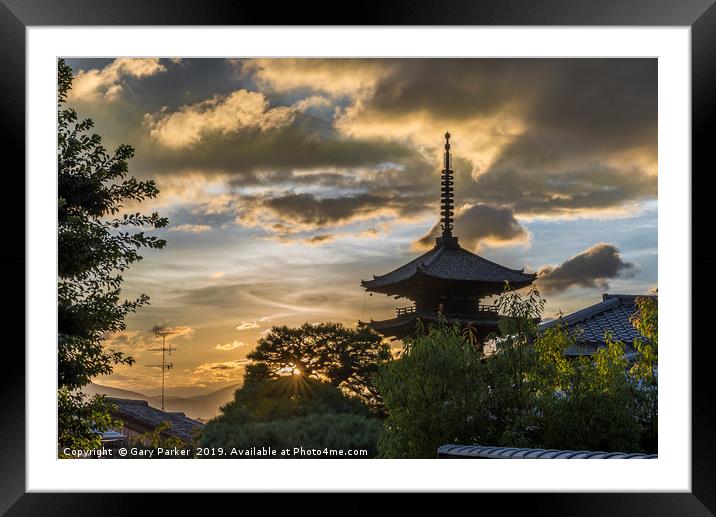 A Japanese pagoda, in Kyoto, framed by a sunset Framed Mounted Print by Gary Parker