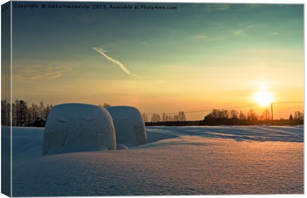 Two Bales In The Winter Sunset Canvas Print by Jukka Heinovirta