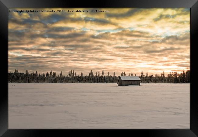 Sunset Over The Snow Covered Fields Framed Print by Jukka Heinovirta