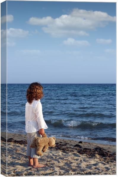 little girl with teddy bear on beach summer season Canvas Print by goce risteski