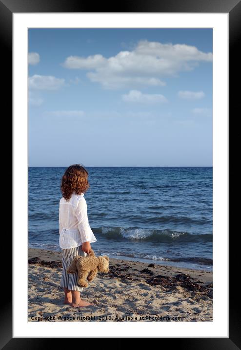 little girl with teddy bear on beach summer season Framed Mounted Print by goce risteski