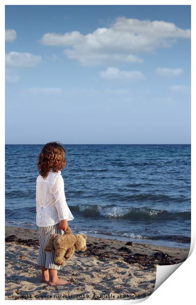 little girl with teddy bear on beach summer season Print by goce risteski