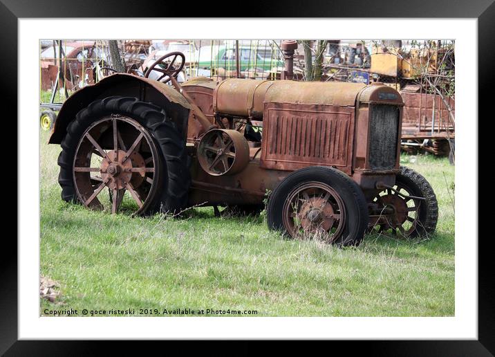 old rusty tractor on field Framed Mounted Print by goce risteski