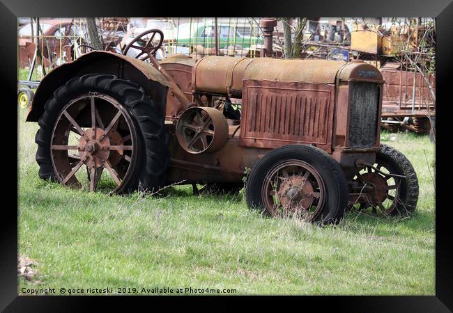 old rusty tractor on field Framed Print by goce risteski
