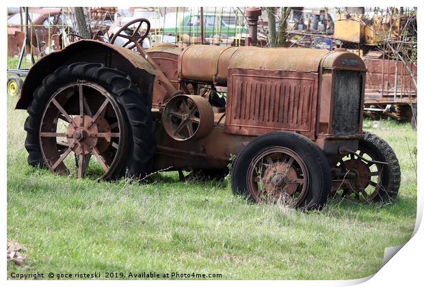 old rusty tractor on field Print by goce risteski