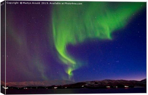 Aurora Borealis over Tromso Norway Canvas Print by Martyn Arnold