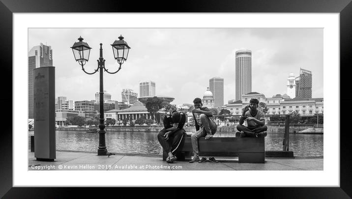 Three men sat on a bench on Boat Quay, Singapore  Framed Mounted Print by Kevin Hellon