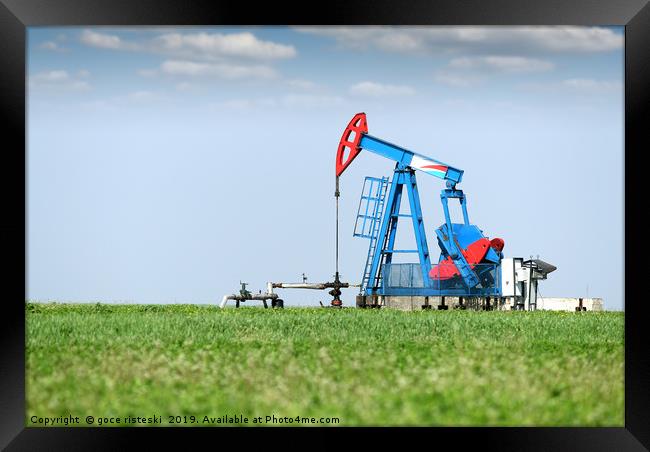 oil pump jack on oilfield Framed Print by goce risteski