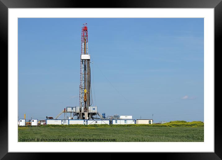 land oil drilling rig on green field landscape Framed Mounted Print by goce risteski