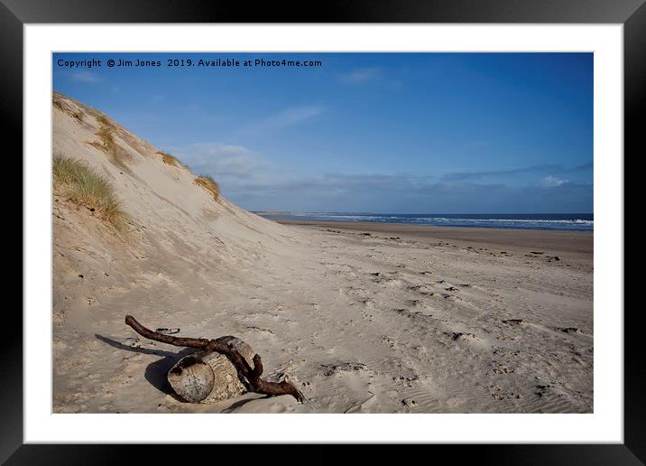 Driftwood on the beach at Druridge Bay Framed Mounted Print by Jim Jones