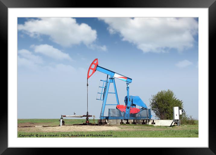 oil pump jack on field Framed Mounted Print by goce risteski